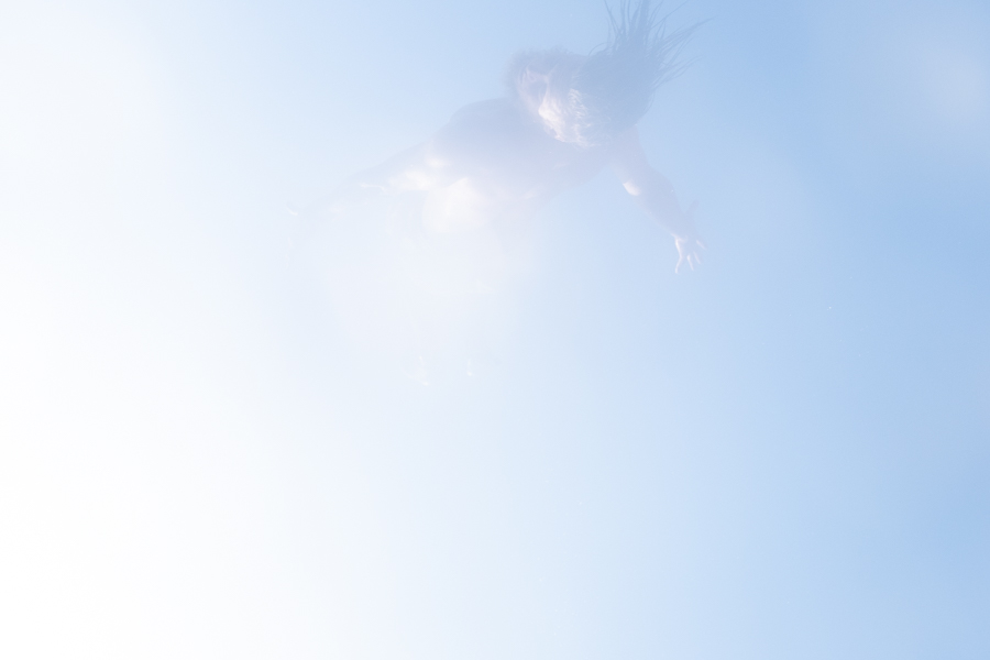 man-diving-air-sky-blue-sun-ethereal