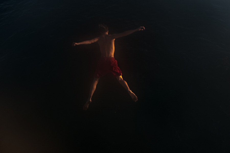 man-jumping-dark-diving
